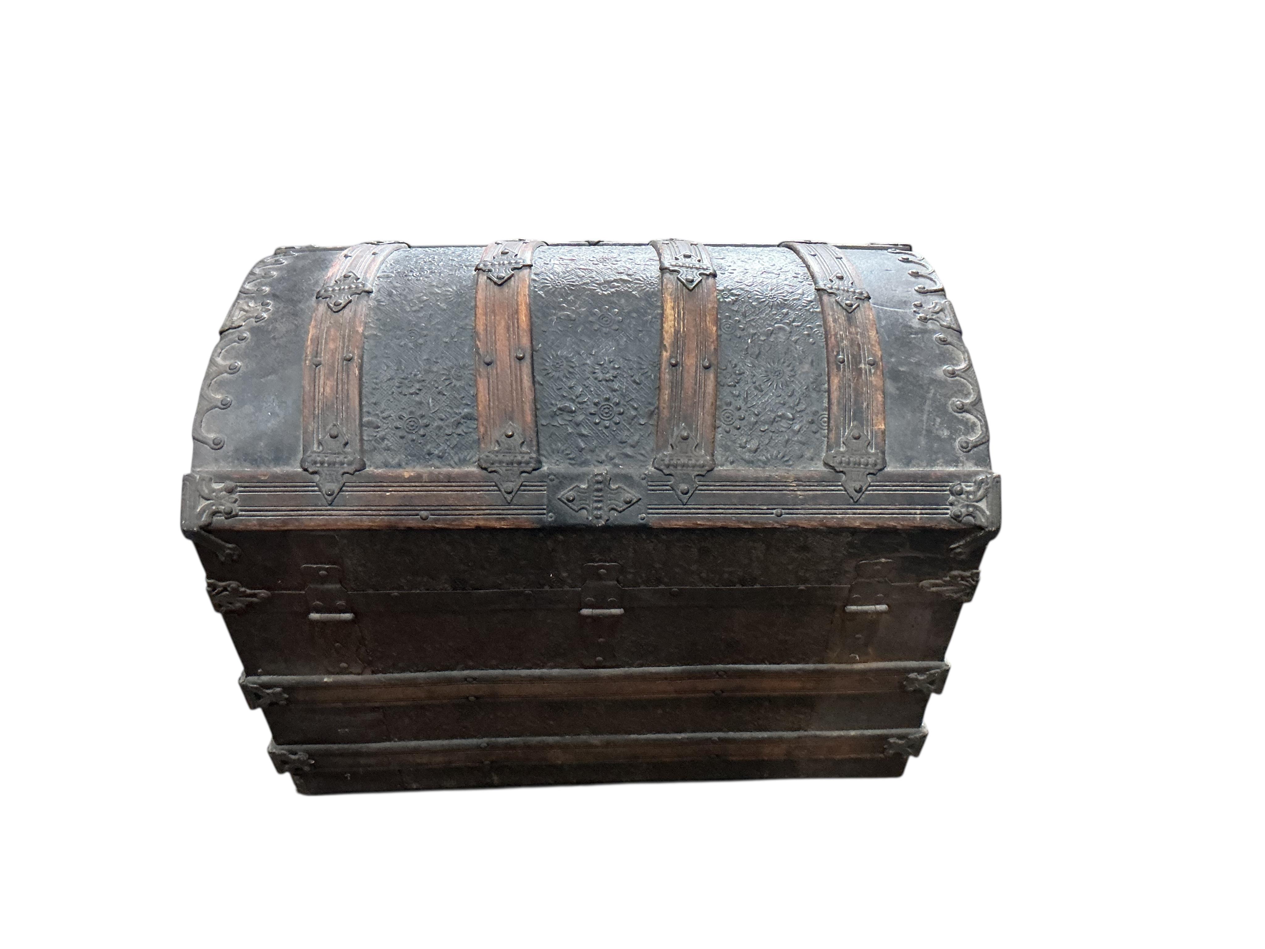 A Victorian metal mounted wood bound domed trunk, width 75cm, depth 46cm, height 54cm